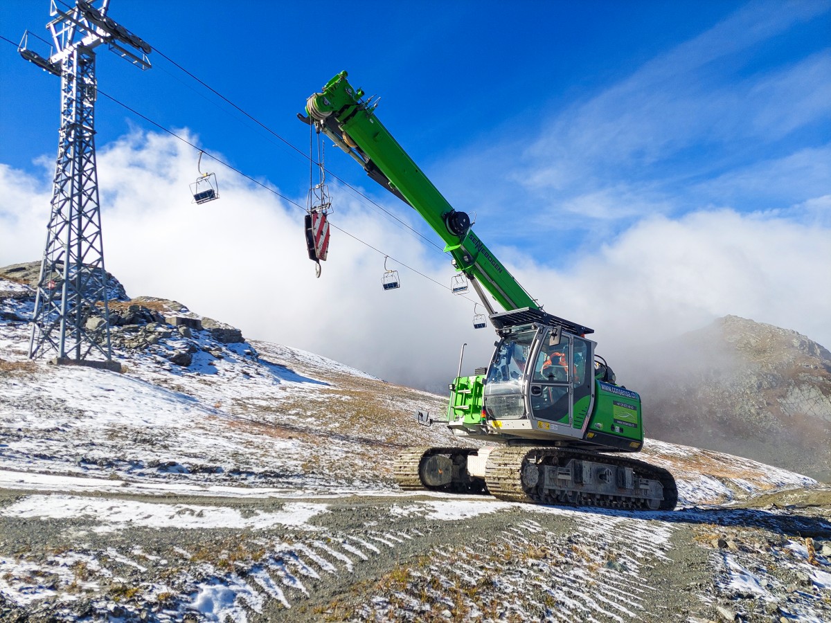Sennebogen's 15 t telescopic crawler crane on construction site in Swiss Alps