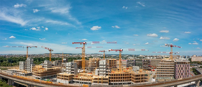 /storage/2022/12/liebherr-ten-tower-cranes-in-the-largest-timber-campus-in-europe_638a025a35c39.jpg