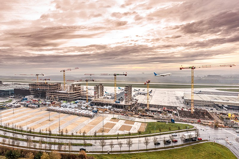 /storage/2023/04/liebherr-cranes-build-sustainable-office-building-at-luxembourg-airport_643bc0ff0ac0b.jpg